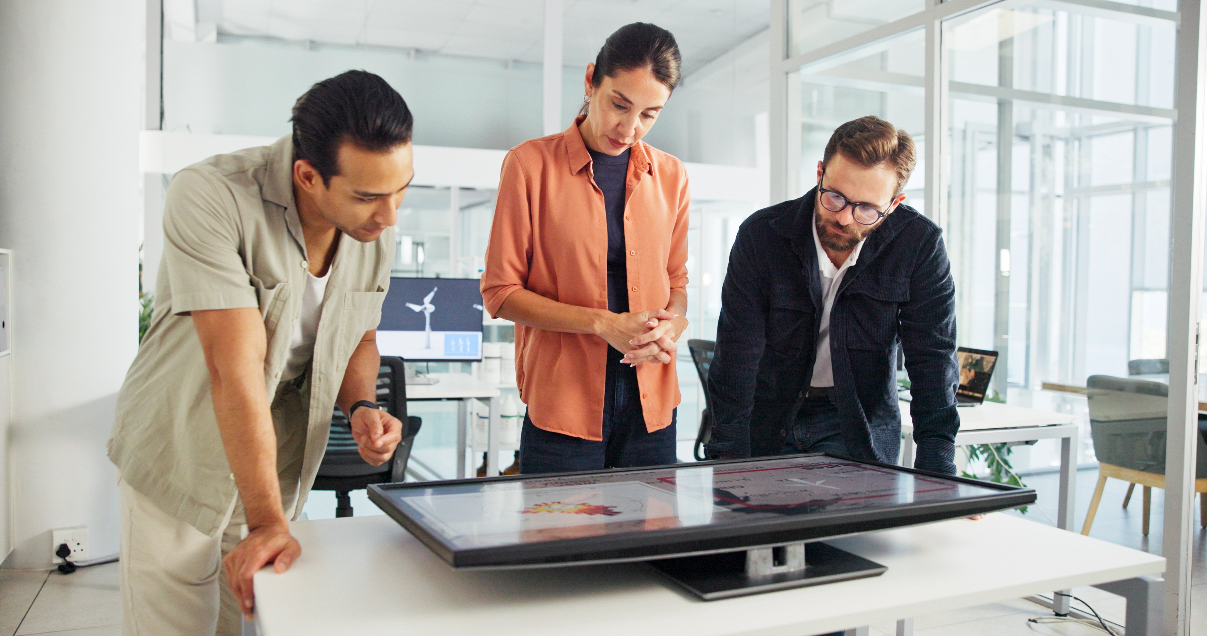 discussion-monitor-group-with-interactive-display-collaboration-planning-windmill-design-teamwork-global-people-with-tech-map-wind-turbine-renewable-energy-world